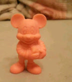 Vintage Soviet toy Mickey Mouse figure in pink rubber holding a bag