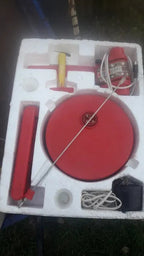 Soviet electric toy plane in red and yellow plastic on its base – detail 5