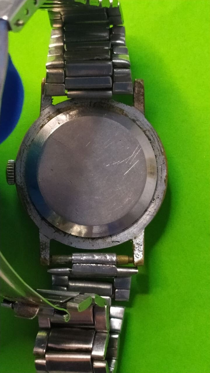 Soviet antique watch chrome-plated case showing brassing and scratches