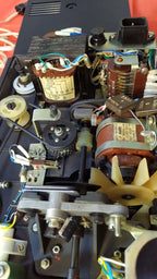 Interior of a Soviet 8mm projector showing original transformer and motor – detail 18