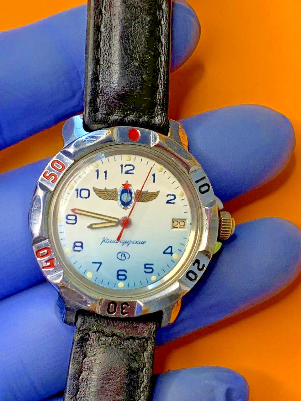 White to light blue gradient dial with winged Air Force emblem and red star