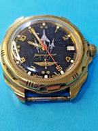 Vostok Komandirskie watch with black fighter jets dial, gold-tone case and rotating bezel