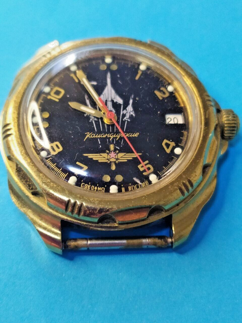 Vostok Komandirskie watch with black fighter jets dial, gold-tone case and rotating bezel