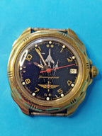 Vintage Vostok mechanical watch head without strap showing plating wear