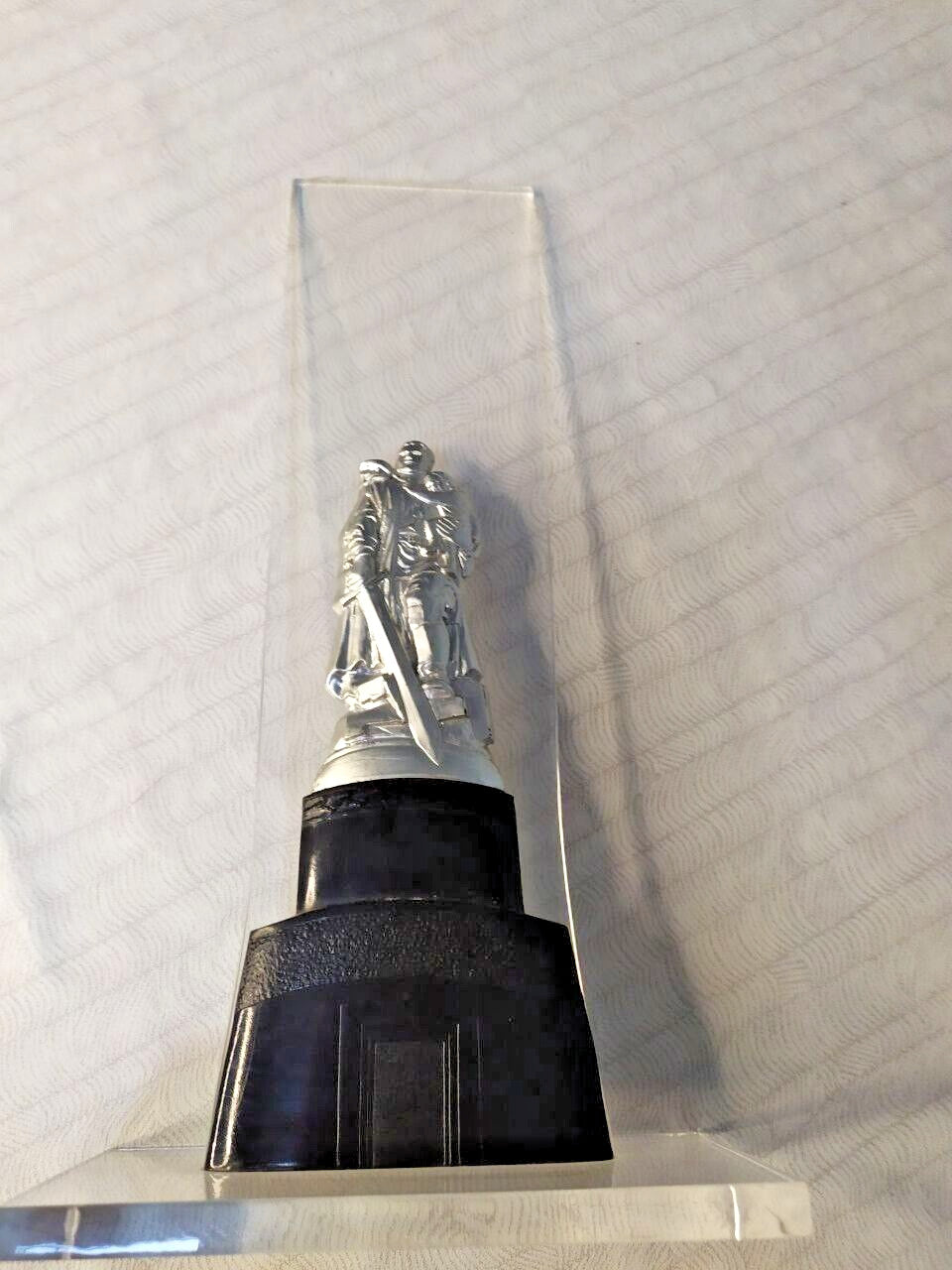 Late USSR commemorative plastic figurine, side view