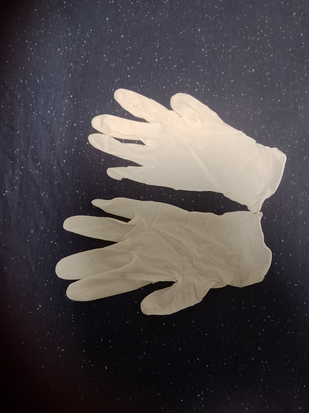 White disposable powder-free latex rubber examination gloves in an open box