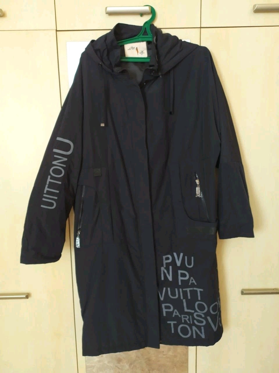 Women's long hooded parka in black with Thinsulate insulation and graphic lettering print