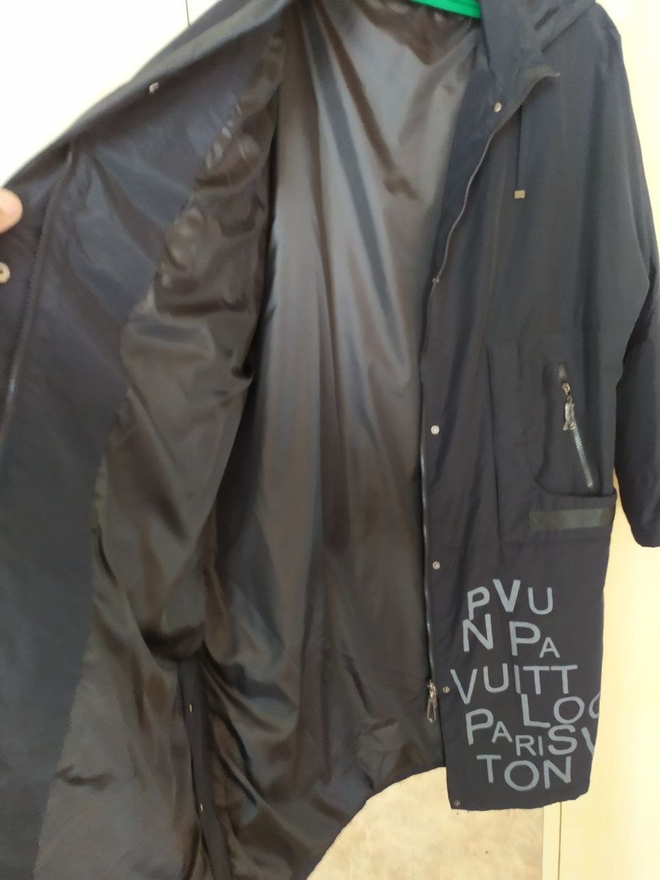 Women's black parka coat with full-length zipper and storm flap – detail 5
