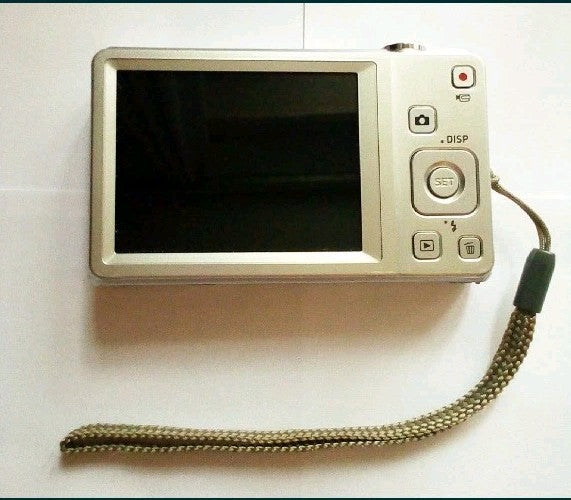 Silver Casio EX-Z88 compact digital camera with attached wrist strap – detail 9