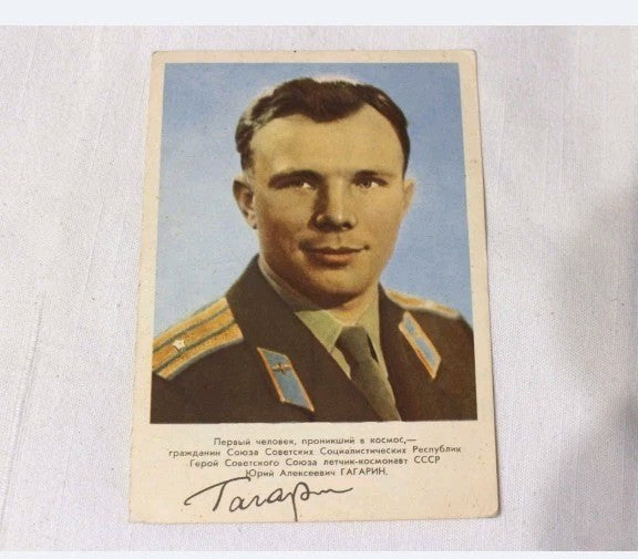 Soviet space memorabilia postcard with color portrait of Gagarin in uniform