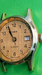 Gold-plated case stamped AU between the lugs