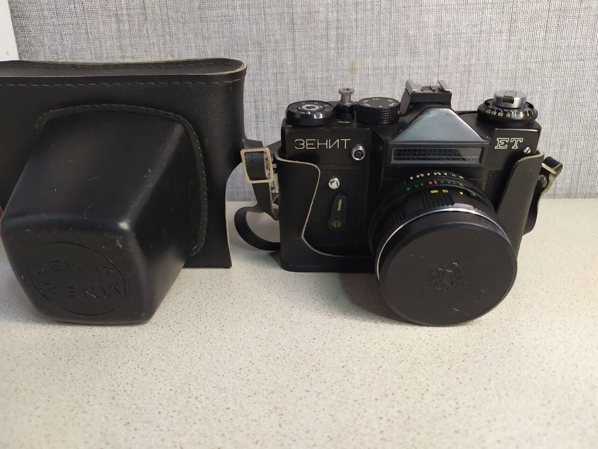 Zenit ET with original lens cap and black leather case with strap