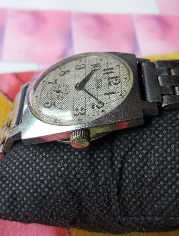 Soviet men's watch with wavy dial and Arabic numerals