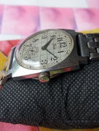 Soviet men's watch with wavy dial and Arabic numerals